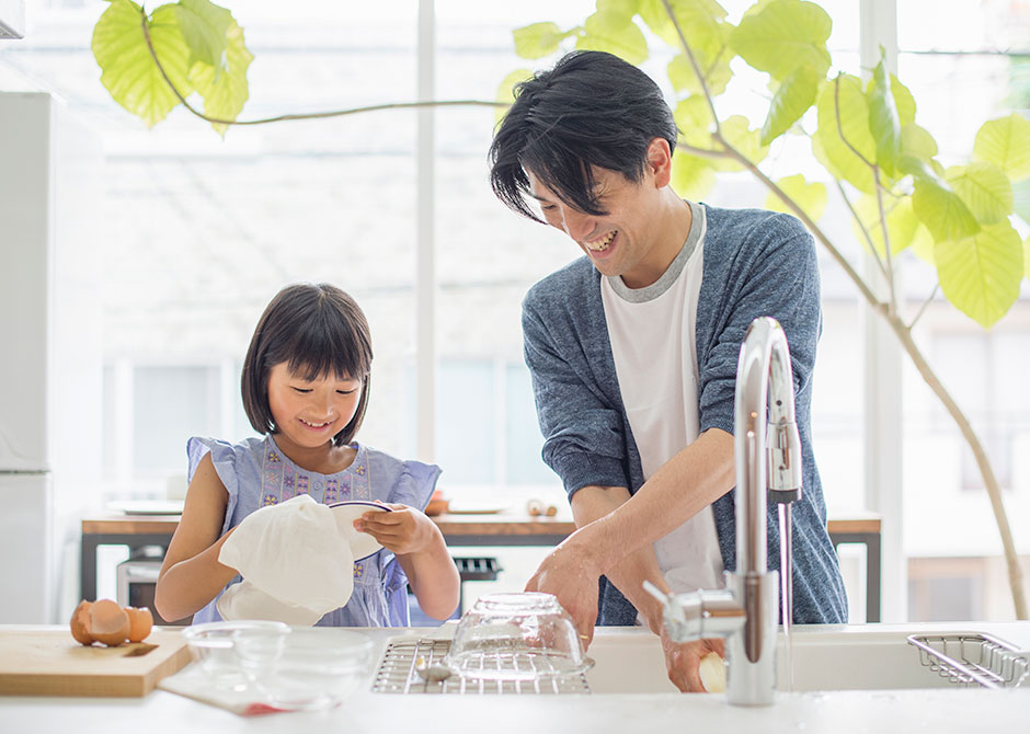 Dad and daughter doing dishes